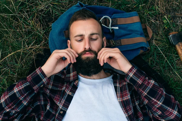 Bearded Man lying on the grass — Stock Photo, Image