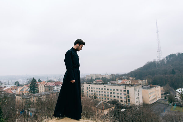 portrait of handsome catholic bearded priest