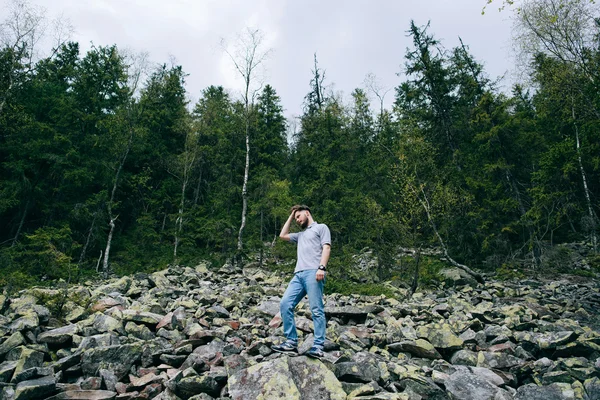 Bearded man in mountain forest — Stock Photo, Image