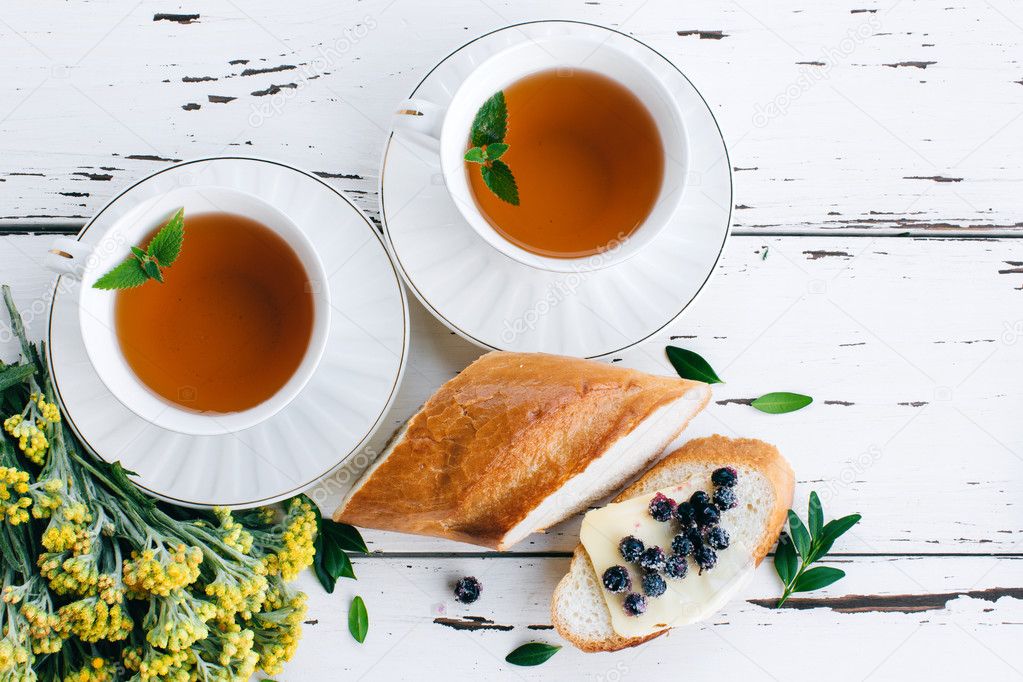 Diet breakfast with Herbal tea and bread with butter and blueberries