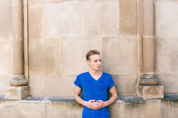 Attractive blue eyed, blond young man on the street — Stock Photo, Image