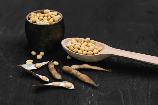 Soybeans pod, harvest of soy beans background Soybeans on a wooden background. rustic style