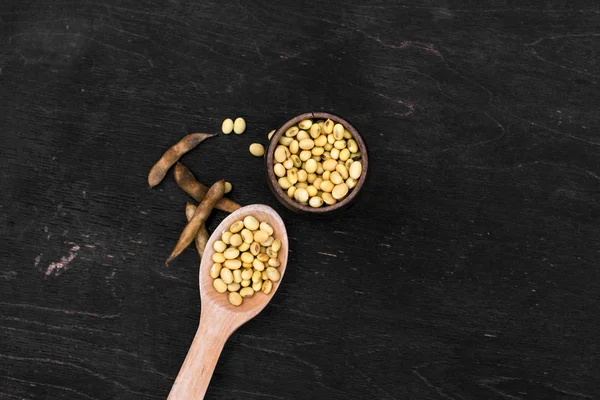 Soybeans pod, harvest of soy beans background Soybeans on a wooden background. rustic style