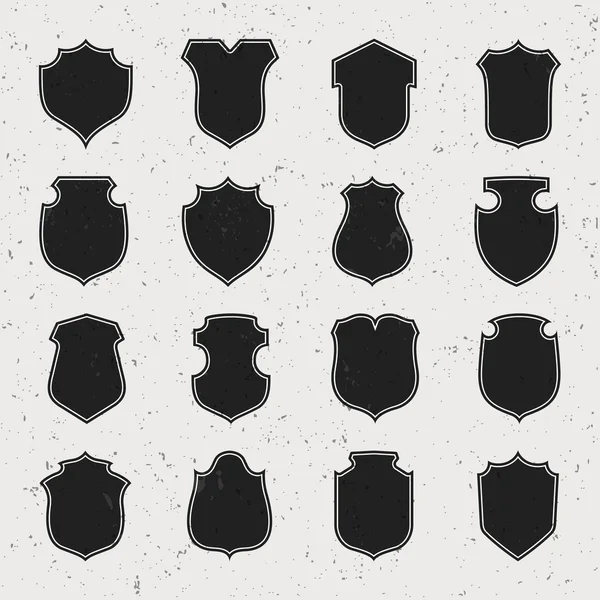 Black shield silhouette — Stock Vector