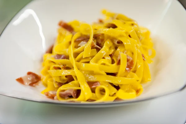 Fettuccine with speck — Stock Photo, Image