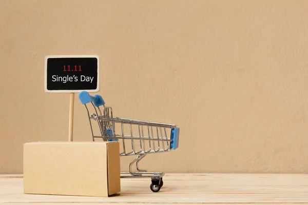 Online shopping of China, 11.11 single\'s day sale concept. The shopping cart and the text 11.11 single\'s day sale with copy space.