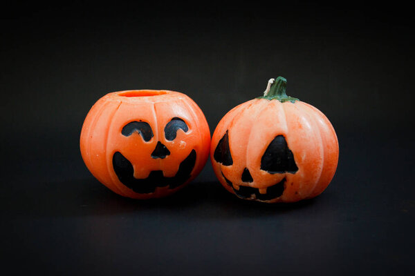 Halloween pumpkins on the black paper background. Halloween background. Space for text. copy space.