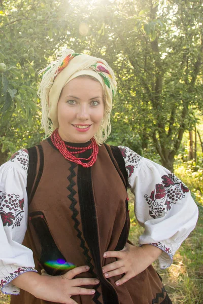 Young girl, Ukrainian national costume, standing barefoot on the — 스톡 사진