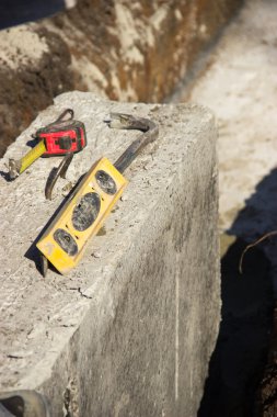 lie on a concrete block construction tools, ruler, level, ruler,
