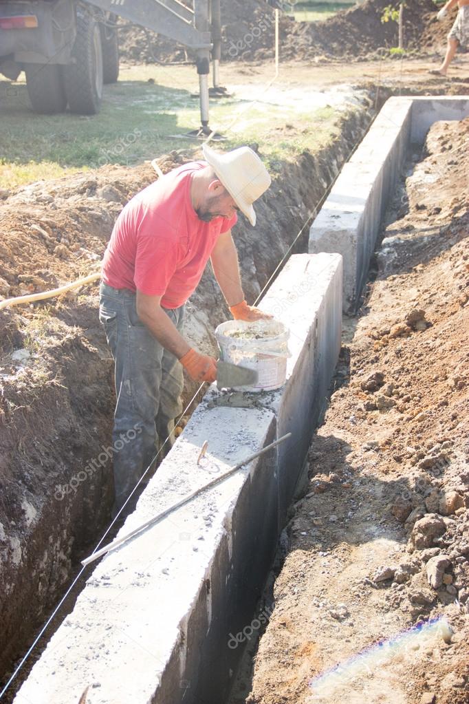 male construction worker working on the construction of the foun