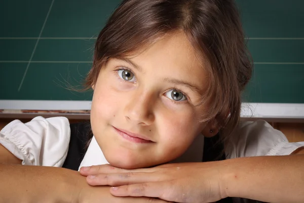 Girl schoolgirl in a black school uniform, a white shirt with tw — Stock Photo, Image