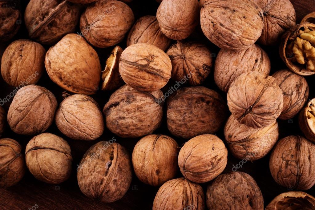 Walnuts whole in their skins, chopped, nut hulls, walnut kernels