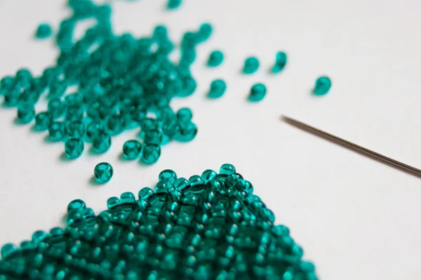 stock image Green beads and needle close-up_1