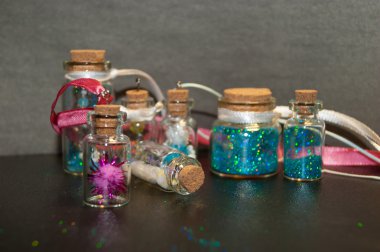 Seven sparkle bottles_1 clipart