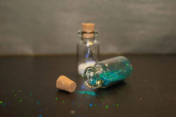 Small bottles with glitter — Stock Photo, Image