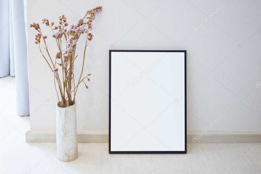 Mock up black photo frame on floor Home interior decoration