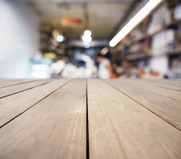 Table top counter with Blur People Shelf display interior Background — Stock Photo, Image