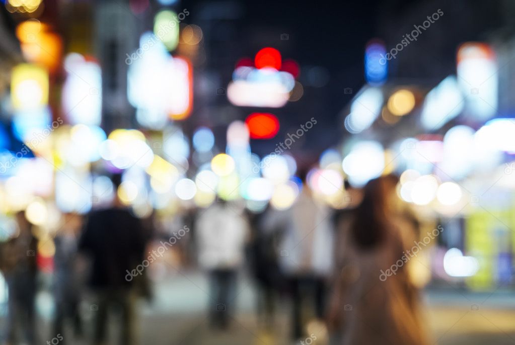 Blurred People walking on Shopping Street City Nightlife