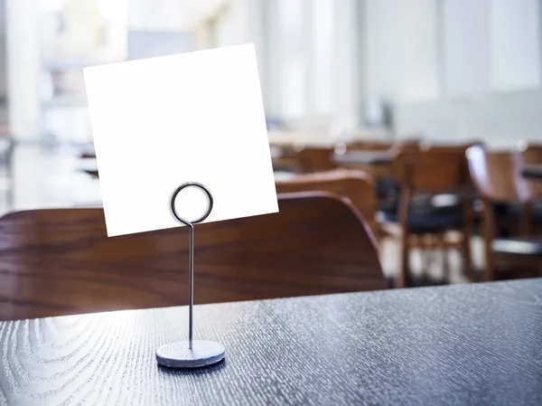 Mock up Paper sign on table Restaurant cafe background — Stock Photo, Image