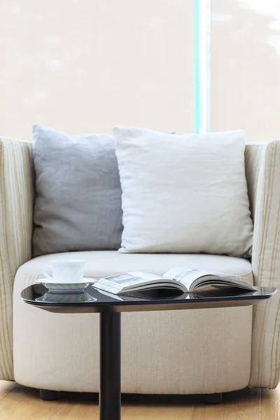 Armchair with pillow coffee and book — Stock Photo, Image