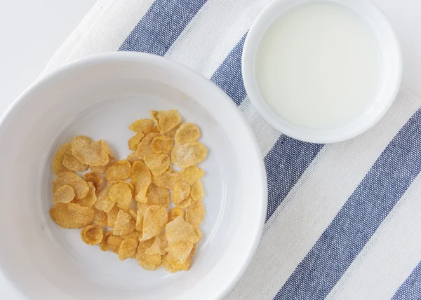 Heart shape cornflake in white bowl and milk — Stock Photo, Image