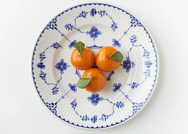 Dessert, orange shape in vintage plate — Stock Photo, Image