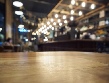 Top of Wooden Table with Blurred Bar restaurant Background