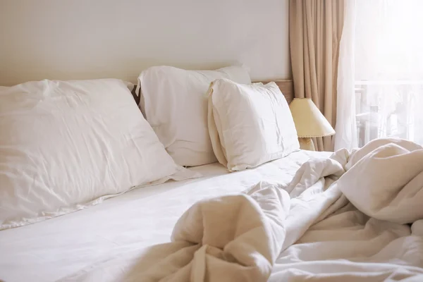 Bed mattress and pillows with blanket messed up in the morning — Stock Photo, Image