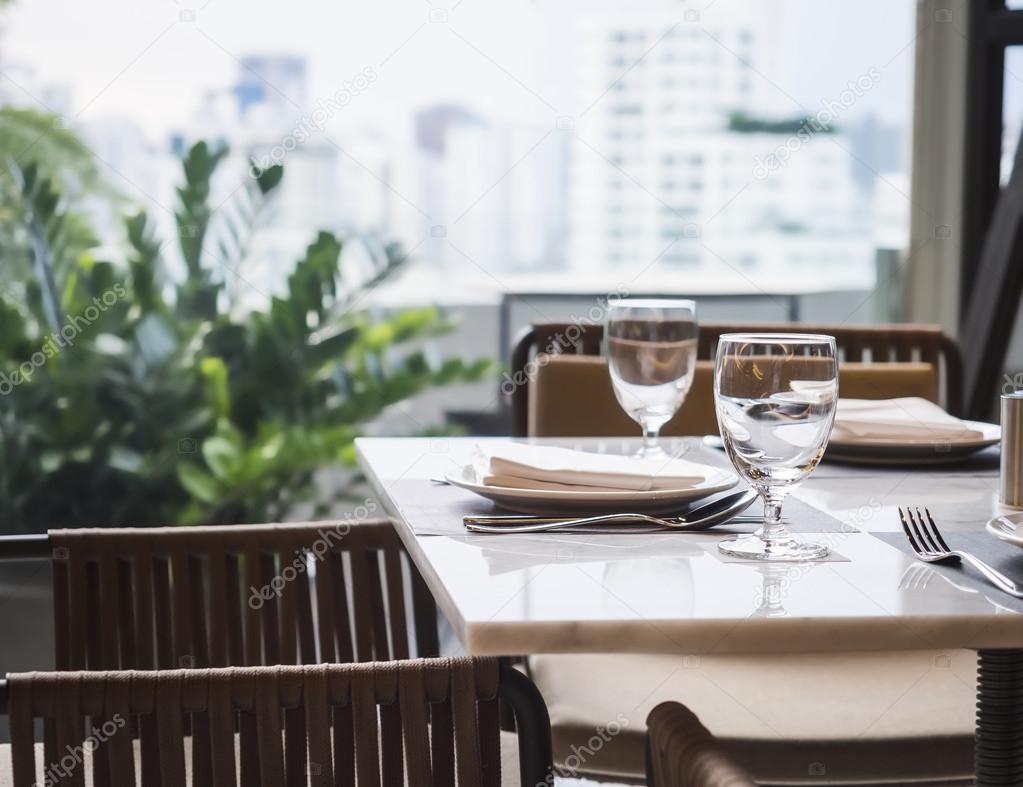 Dining Table set Restaurant garden and skyline view