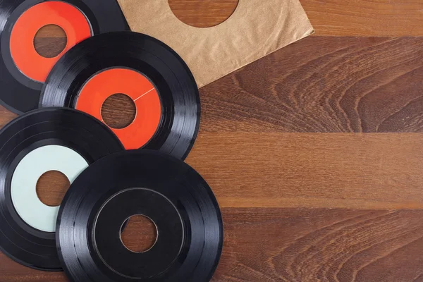 Record vinyl and wooden background — Stock Photo, Image