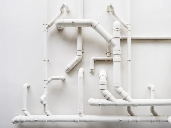 Pipeline Plumbing system on white wall — Stock Photo, Image