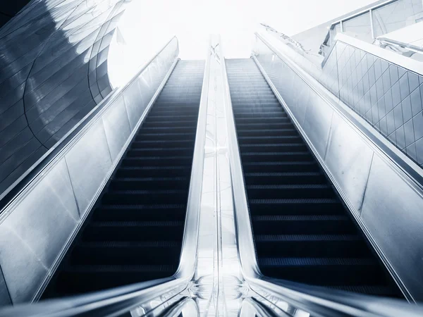 Escalator interior Modern building Blue toned images — Stock Photo, Image