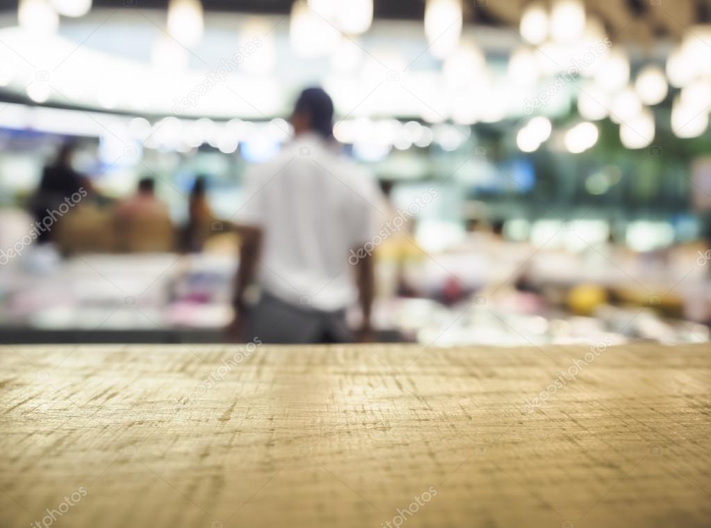 Table top Counter with Blurred People in Shop