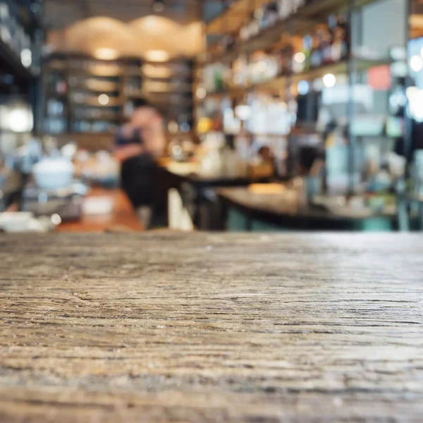 Tabell top Counter Bar med suddig butik lagra bakgrund — Stockfoto