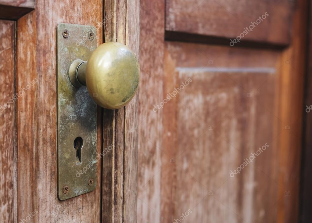 Old Doorknob With Keyhole On Wooden Door Stock Photo