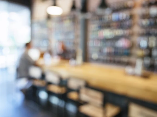 Blurred counter bar background with people drinking beer — Stock Photo, Image