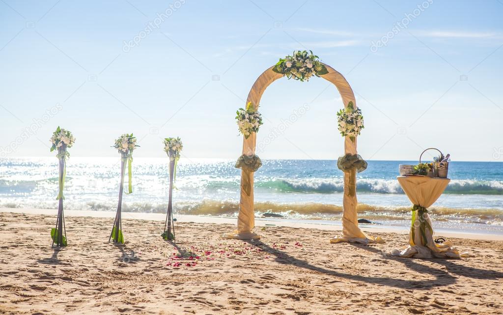 Wedding ceremony on the shore of the ocean sea arch on the beach