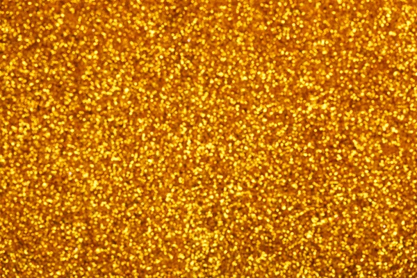 Guld glitter bokeh bakgrund. — Stockfoto