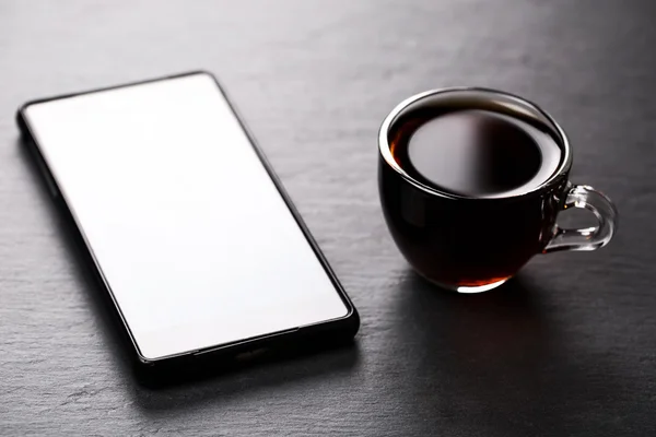 Phone and cup of espresso — Stock Photo, Image