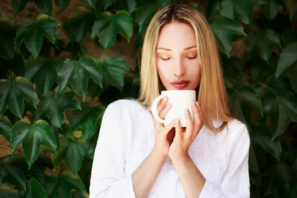 Beautiful woman with white cup — Stock Photo, Image