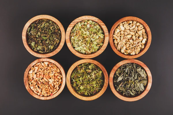 Assortment of dry tea in little bowls — Stock Photo, Image