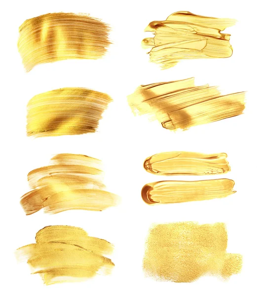 Uppsättning av gyllene penseldragen, isolerad på vit. — Stockfoto