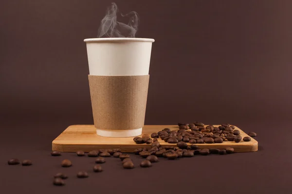 Cup of coffee with beans — Stock Photo, Image