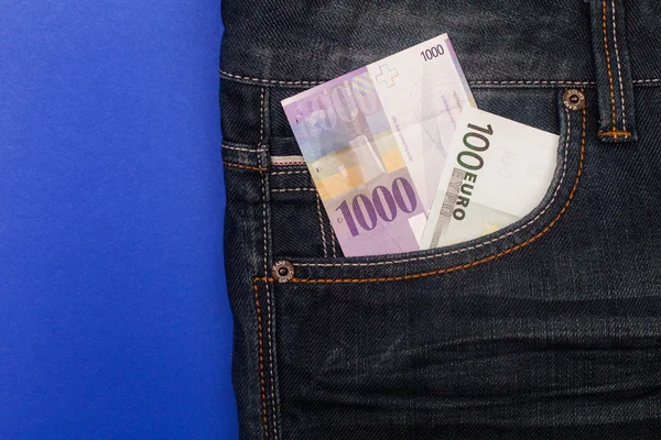 CHF and euro in pocket — Stock Photo, Image