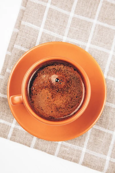 Cup of espresso on squared napkin — Stock Photo, Image