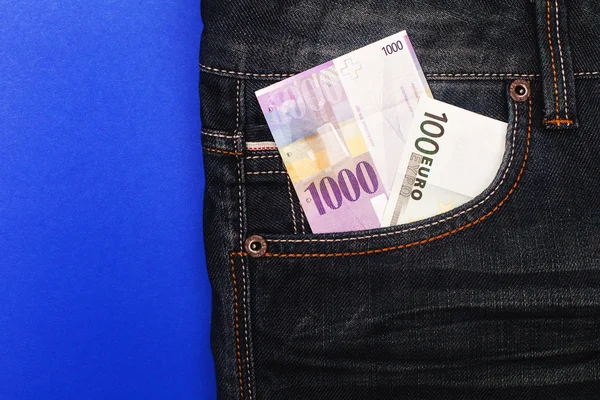 CHF and euro in pocket — Stock Photo, Image