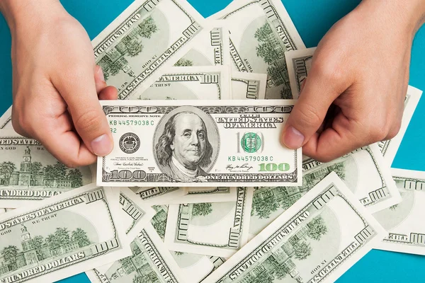 Mans hands holding dollars — Stock Photo, Image