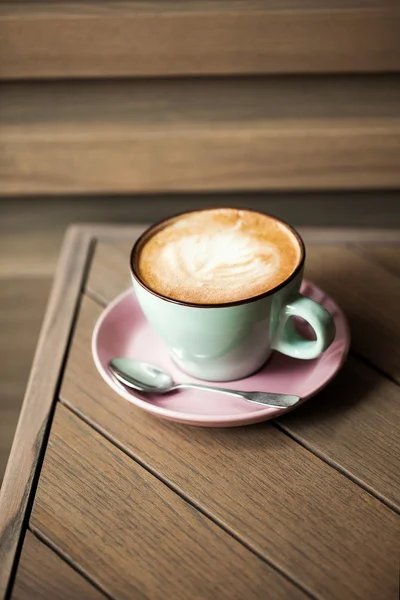 Cappucino on wooden table — Stock Photo, Image