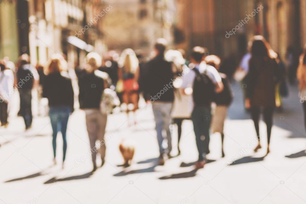Blurred crowd of walking people in the city