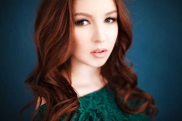 Portrait of beautiful woman in green lace dress — Stock Photo, Image